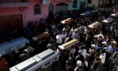 People carry the coffins